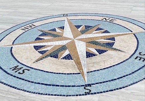 A beautiful compass mosaic tile